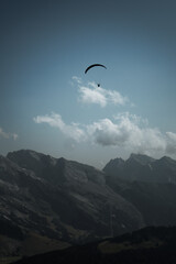 Fototapeta na wymiar paragliding flight in the mountains. Le Grand-Bornand, France
