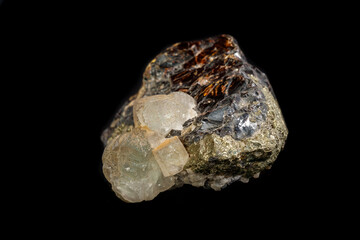 Macro of a mineral stone Sphalerite with fluorite and pyrite on a black background close up