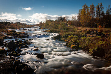 Ellidaa river in autumn, Reykjavik, Iceland. Long exposure photo. 