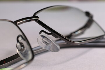 The frame of the glasses was taken on a macro on the table.