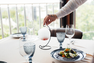 An exquisite salad of seafood, tuna and black caviar in a beautiful serving on the table in the restaurant. Exquisite delicacies of haute cuisine close-up.