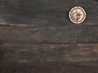 wooden clock on old wooden background