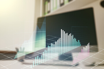 Multi exposure of abstract creative financial graph and modern desktop with computer on background, forex and investment concept