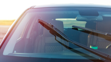 Car windshield brushes. Concept for cleaning products, polishing, anti-rain - obrazy, fototapety, plakaty