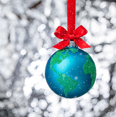 Peace on Earth Globe christmas ball ornament with snowy winter background