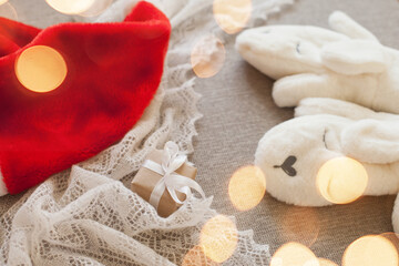christmas gift box, red santa hat and white mittens for winter holidays