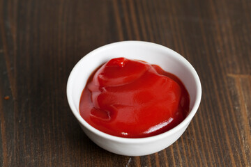 tomato red ketchup poured into a red plate