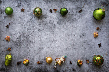 Christmas background with decoration like Christmas balls, pine cones, on a gray, rustic background in vintage style