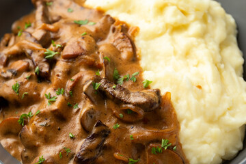 Beef Stroganoff with mushrooms and mashed potatoes.