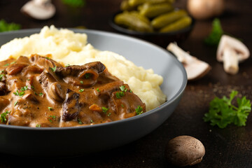 Beef Stroganoff with mushrooms and mashed potatoes.