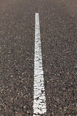 Obraz premium paved road with white road markings for transport management