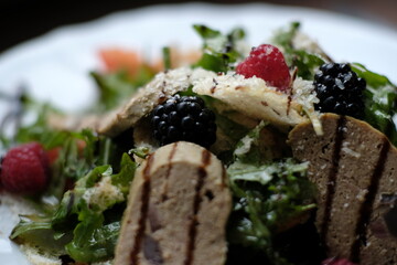 salad of herbs, berries and meat pate
