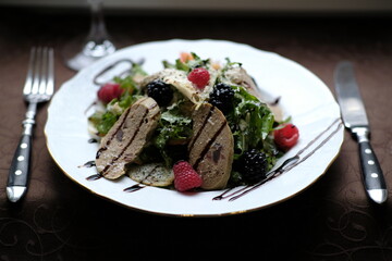 salad of herbs, berries and meat pate