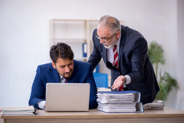 Two male colleagues working in the office