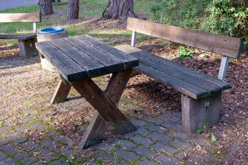 wooden bench and wooden table in the park