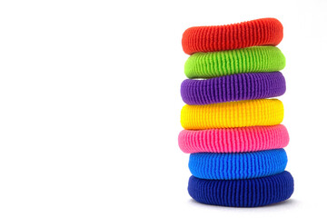 Column of multicolored scrunchies, elastic hair ties, cotton hair ponytail holders, seamless hair bands