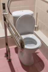 Toilet, shower and bathroom equipped with handrails for people with disabilities. Comfort and care for the disabled