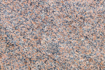 granite texture close up, red and black spots. rough stone