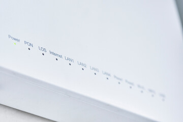 Close-up view of Internet wi-fi router device. Icons on the Wi-Fi router indicating the signal and connection. Wi-Fi modem router. Fast internet modem device