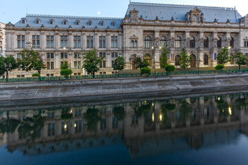 Fototapeta na wymiar Palace of Justice and Dambovita River in Bucharest, Romania