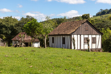 Fototapeta na wymiar Farm field with old house in german style