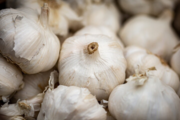 A Close Up of Whole Garlic For Sale on a Market Stall