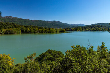 Fototapeta na wymiar Located in Isparta Eğirdir, Turkey, Lake Kovada National Park is getting ready for autumn...