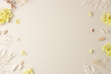 Cosmetic background with flowers on pastel beige. Flat lay, copy space