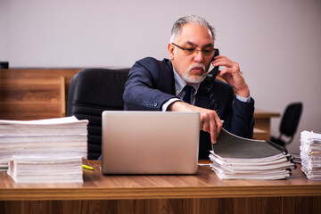 Old male employee and too much work in the office