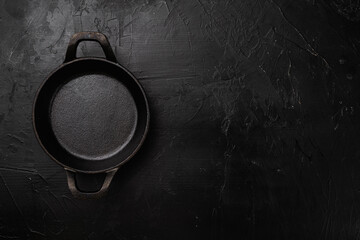 Black Empty clay pot with copy space for text or food with copy space for text or food, top view flat lay , on black dark stone table background