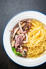 pasta seafood spaghetti mussel, squid, octopus, shrimp fresh meal snack on the table copy space food background rustic 