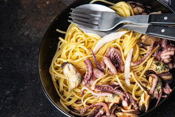 pasta seafood spaghetti mussel, squid, octopus, shrimp fresh meal snack on the table copy space food background rustic 