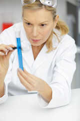mature woman working with pipettes