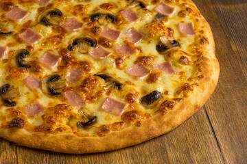 Ruddy mushroom pizza baked with mushrooms, ham and cheese