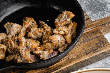 Potatoes with chanterelles, on gray stone table background