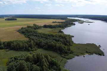 Aerial view of summer landscape with forest river and fields
