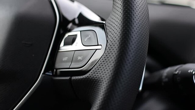 SRC - Source in a modern car on the multifunction steering wheel