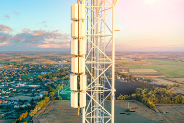 Telecommunication tower with antennas, 4g, 5g. Cellular. Against the background of the blue sky.