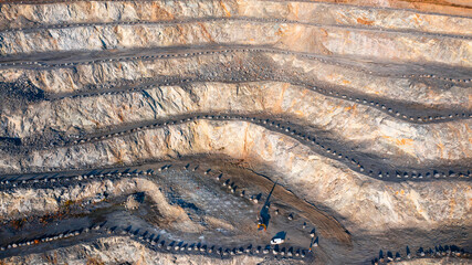 aerial view of the interior of a deep stone quarry, large rocks