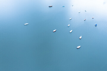 Aerial view of small sailing yachts moored in the lake