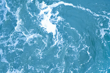 Strong swirl of water for the background. Water waves