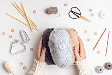Craft hobby background with yarn in natural colors. Recomforting, destressing hobby for cold fall...