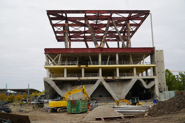 Ruins, lost places: Deserted and abandoned pavilion of a former world exposition, now only being demolished. Massive wooden trunks that supported a heavy concrete ceiling.