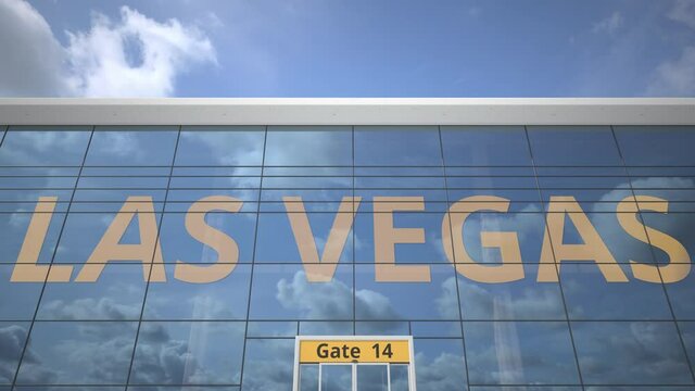 LAS VEGAS city name and landing airplane at airport terminal
