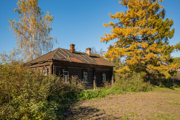 Old ruined wooden house in the village