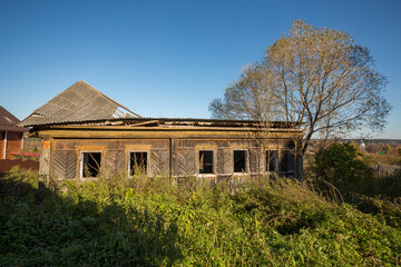 Old ruined wooden house in the village