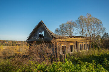 Old ruined wooden house in the village
