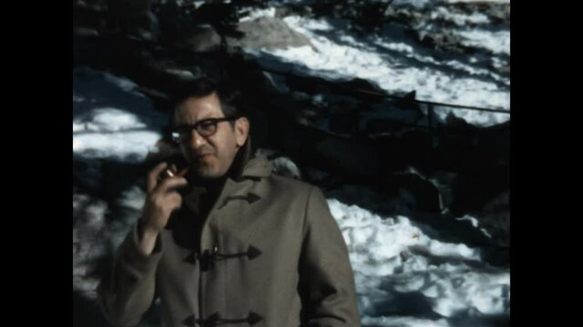 Cold Day and Pipe 1967 - A man smokes his pipe on a cold day while wearing a wool coat  