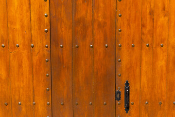 Fototapeta premium Old wooden door with iron handle