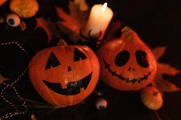 Small Pumpkins Scary Scared Smiles. Halloween Pumpkins Set up. Halloween Decoratins on Table.